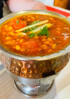 Chana masala in a hammered copper bowl